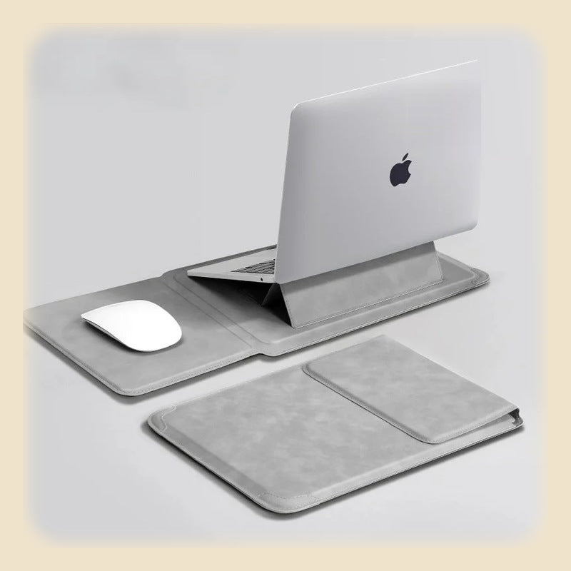 Ljusgrått laptopfodral uppfällt som ställ