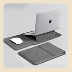 Mörkgrått laptopfodral uppfällt som ställ