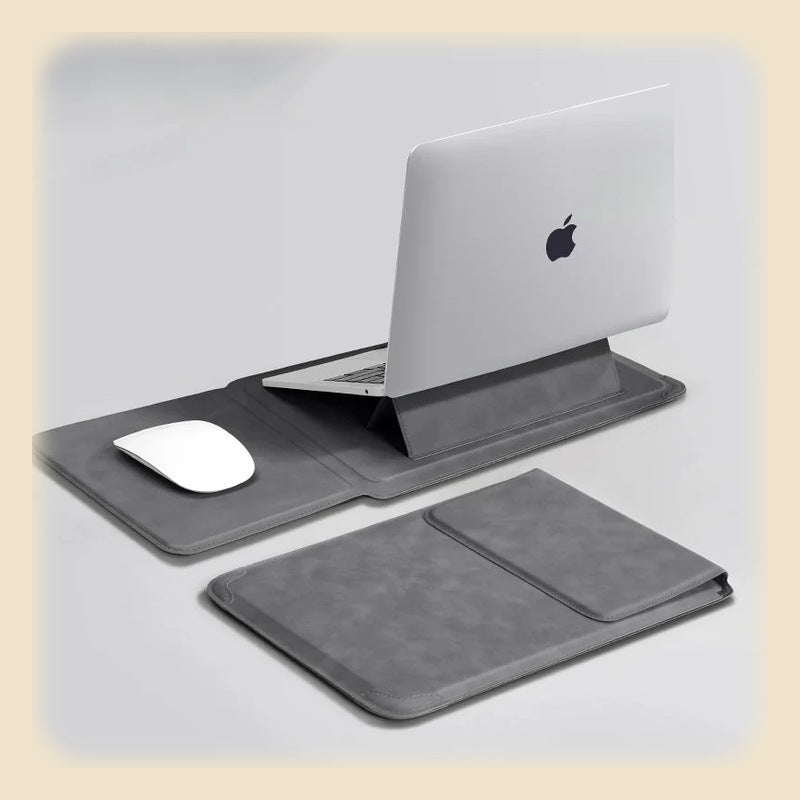 Mörkgrått laptopfodral uppfällt som ställ